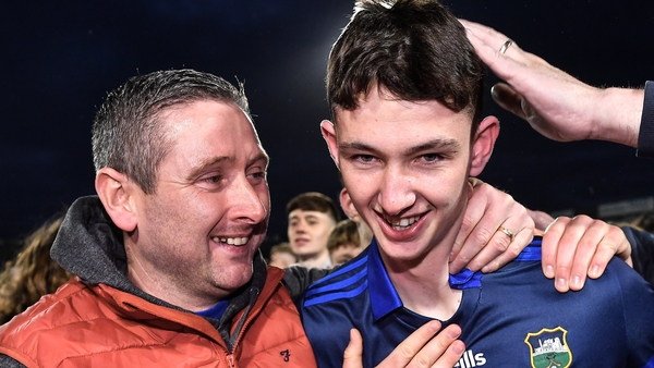 Tipperary goalkeeper Eoin Horgan celebrates with his father, and inter-county referee, Fergal Horgan