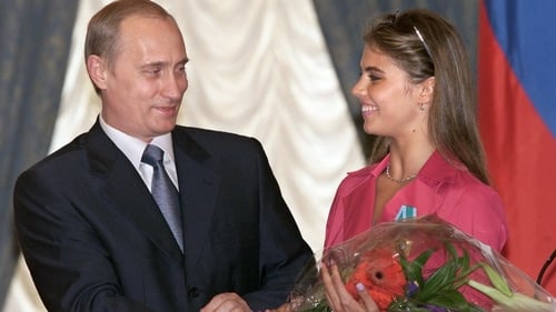 Russian President Vladimir Putin pictured in 2001 with gymnast Alina Kabaeva at an awards ceremony