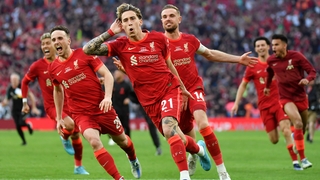 Kostas Tsimikas celebrates after converting Liverpool's winning penalty at Wembley
