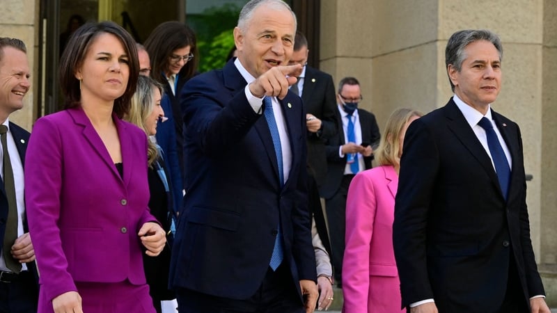NATO Deputy Secretary General Mircea Geoana gestures with German Foreign Minister Annalena Baerbock and US Secretary of State Antony Blinken in Berlin