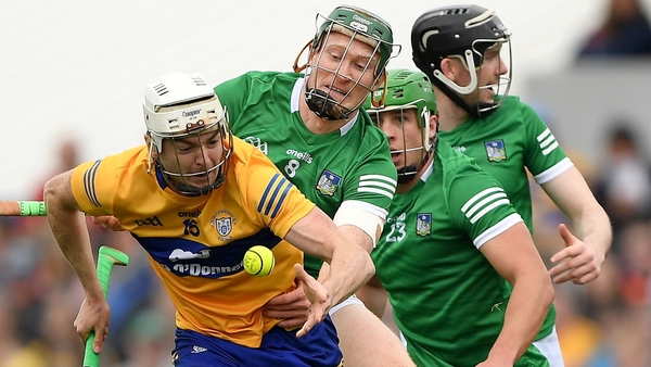 Clare forward Ryan Taylor is tackled by William O'Donoghue
