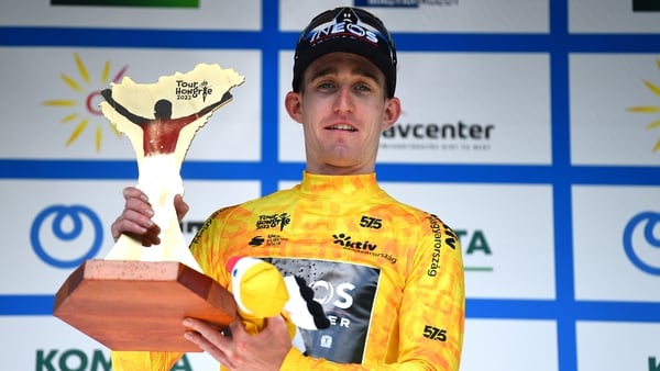 Eddie Dunbar with the trophy following his win in Hungary