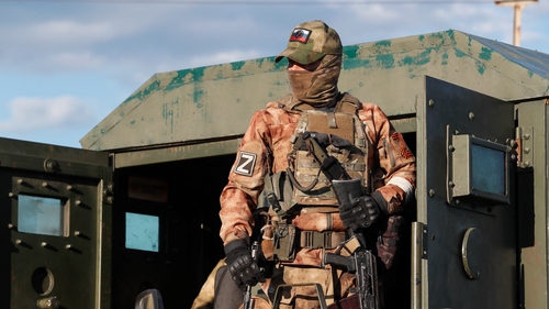 Russian forces stand guard outside the Azovstal steelworks