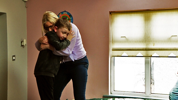 Gillian hugs Kyle, one of her 11-year-old twins
