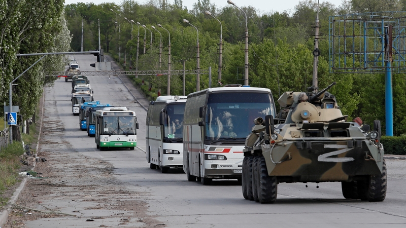Buses carrying Ukrainian soldiers who surrendered after weeks holed up at Azovstal steel works in May 2022