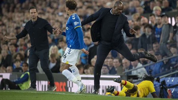 Crystal Palace manager Patrick Viera avoids a falling Jeffrey Schlupp
