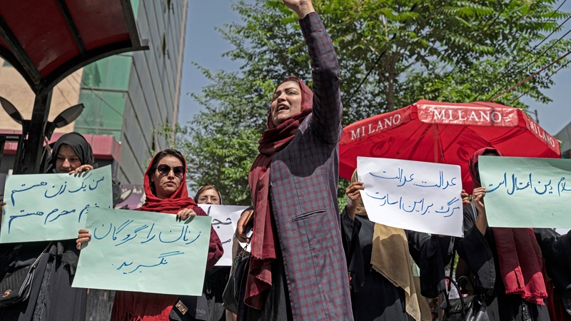 Members of Afghanistan's Powerful Women Movement take part in a protest in Kabul on 10 May, 2022.