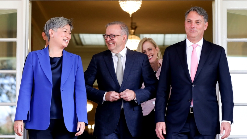Anthony Albanese (C), Penny Wong, foreign affairs minister, (L), and Richard Marles, deputy prime minister (R), leave the Government House after being sworn in at a ceremony in Canberra
