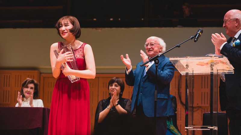 Yukine Kuroki following her win at the NCH, with President Michael D. Higgins, John O'Conor and members of the jury. (Photo: Erica Coburn)