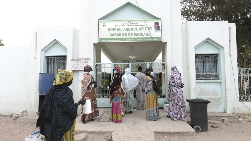 Visitors stand in front of the Mame Abdoul Aziz Sy Dabakh Hospital where the babies died