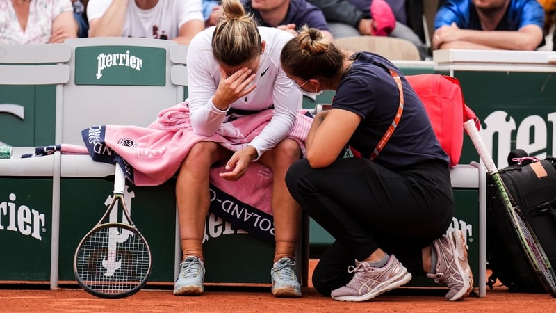 Simona Halep receives medical assistance on Court Simonne-Mathieu