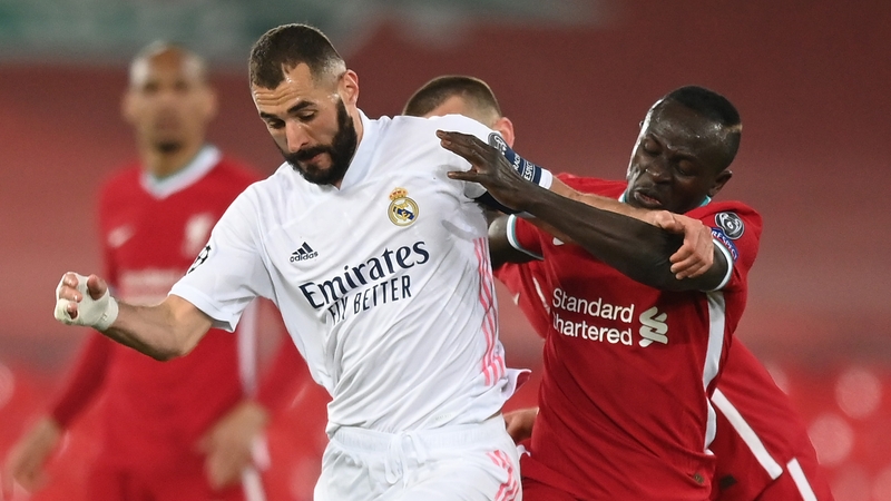 Karim Benzema and Sadio Mane battle for the ball during last season's quarter-finals