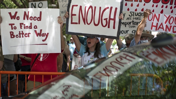 Protesters gathered outside the venue in Houston
