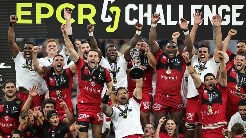 Lyon captain Jordan Taufua raises the Challenge Cup