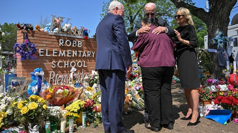 US President Joe Biden embraces Mandy Gutierrez, the Principle of Robb Elementary School, as he and First Lady Jill Biden pay their respects in Uvalde, Texas