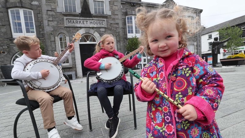 Musicians Oisin Wallace and Nicole Reynolds with Fleadh Cheoil supporter Lauren Reynolds in Mullingar