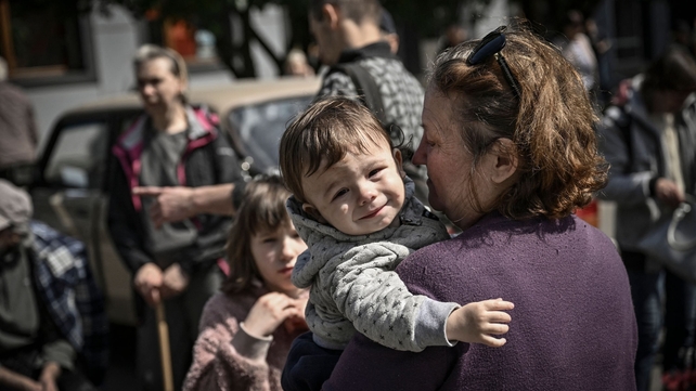 People evacuate the city of Bakhmut, in the eastern Ukranian region of Donbas on 24 May