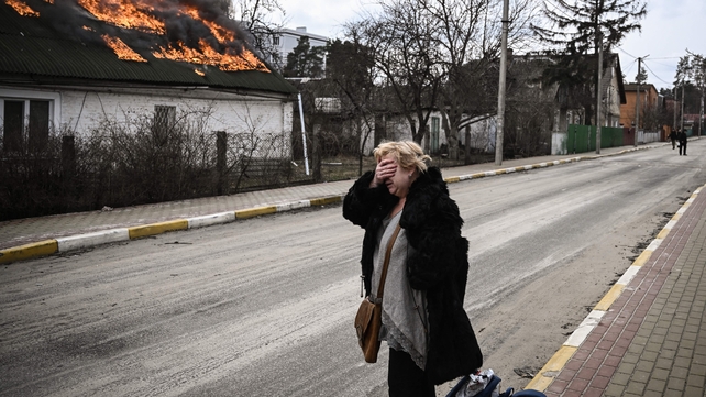 Homes burning in the city of Irpin after shelling on 4 March