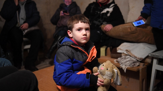 Five-year-old Mikhailo waits in an underground shelter during a bombing alert in Kyiv on 26 February