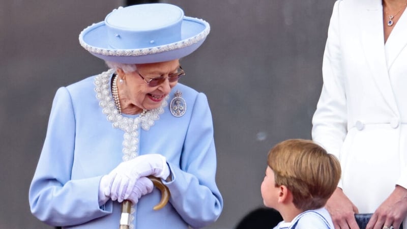 Britain's Queen Elizabeth II shares a joke with her great-grandson Prince Louis