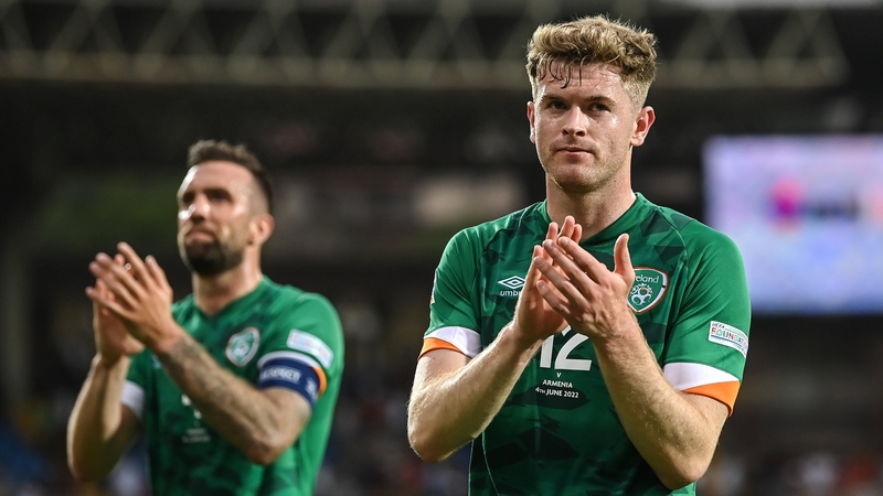 Nathan Collins (R) applauds the fans