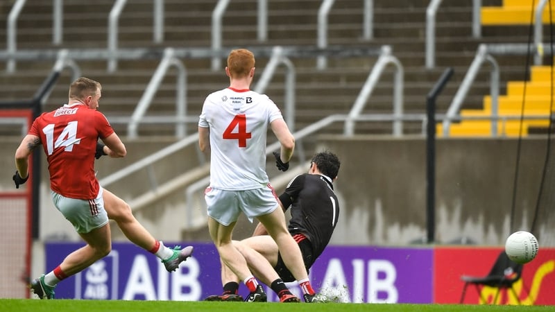 Brian Hurley shoots to score Cork's first goal against Louth