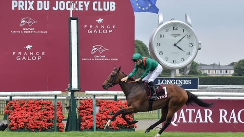 Christophe Soumillon gives Vadeni a pat down the neck as the son of Churchill hits the finish line at Chantilly