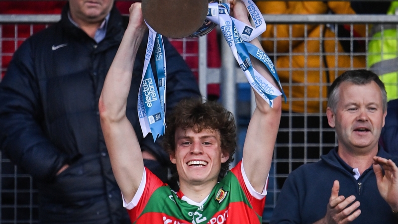 Mayo captain Diarmuid Duffy lifts the cup after his side's victory