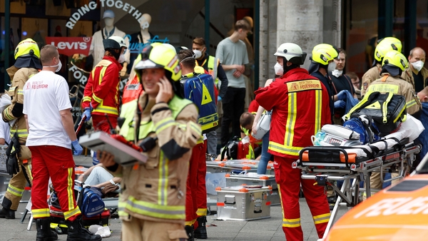Rescue workers help injured people at the scene