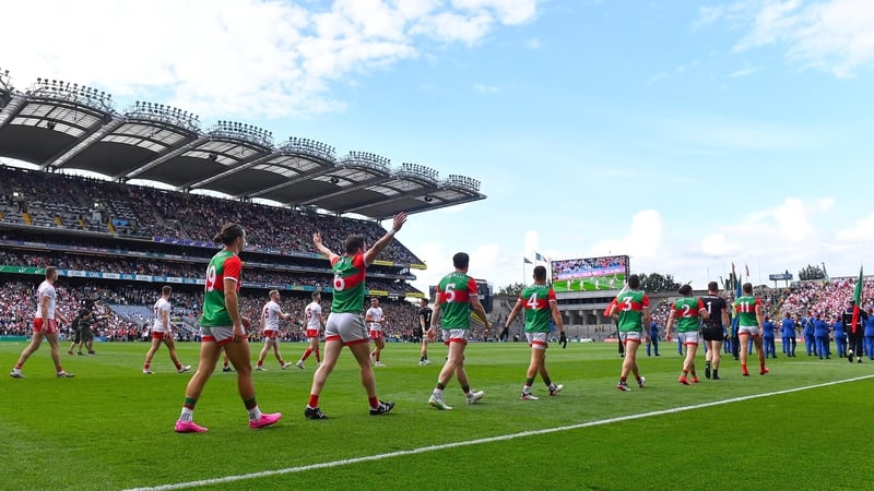 Mayo players walk behind the parade for the 2021 All-Ireland football final