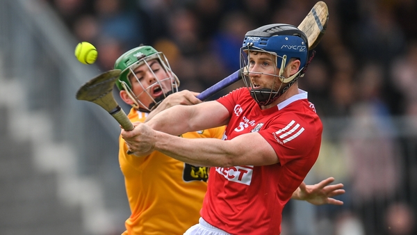 Conor Lehane gets a shot away with Antrim's Gerard Walsh in close proximity