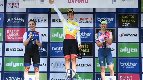 Elisa Longo Borghini (c) takes the plaudits after her victory