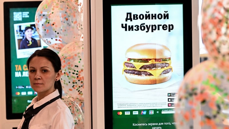An employee at Vkusno & Tochka, the new chain which has taken over McDonald's restaurants in Russia after the fast food giant left the country. Photo: Kirill Kudryavtsev/AFP via Getty Images
