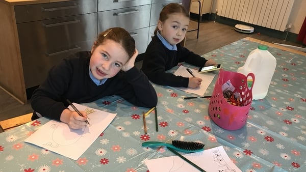 Nellie and Eppie drawing pictures of stories in December 2017