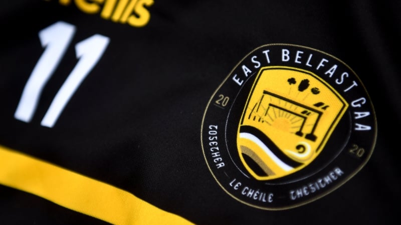 East Belfast's club crest features the iconic Harland & Wolff cranes, a sunrise, the Red Hand of Ulster, a shamrock and a thistle and the word 'Together' written in English, Irish and Ulster-Scots.