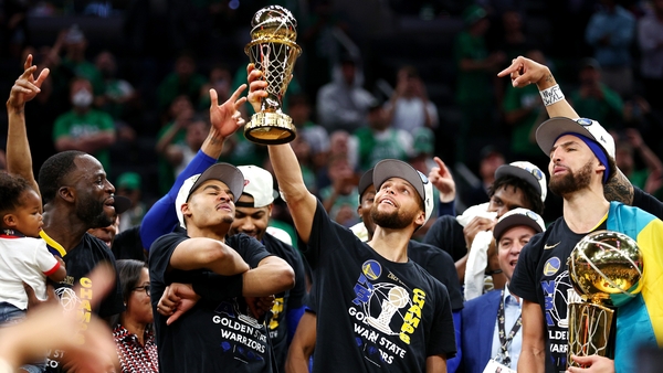 Steph Curry raises the Bill Russell NBA Finals Most Valuable Player Award