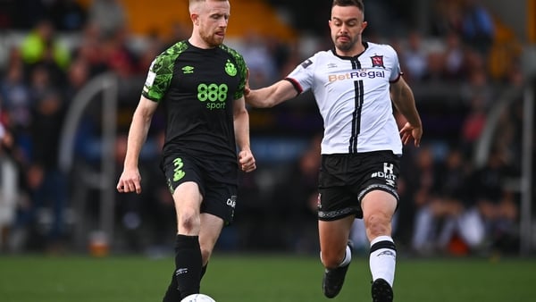 Sean Hoare of Shamrock Rovers in action against Robbie Benson of Dundalk