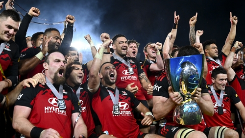 Oli Jager (bottom left) celebrates with his Crusaders team-mates