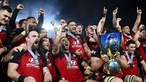 Oli Jager (bottom left) celebrates with his Crusaders team-mates