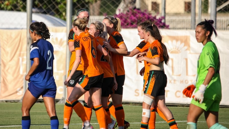 Lily Agg celebrating with her team-mates