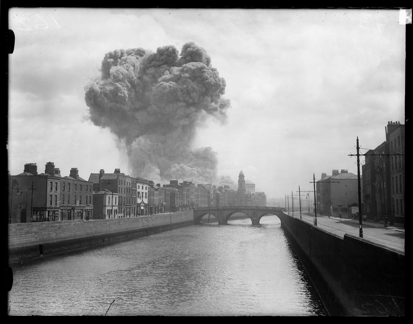 The massive mushroom cloud generated by the detonation of mines and explosives at the height of the assault (Credit: RTÉ Cashman Collection)