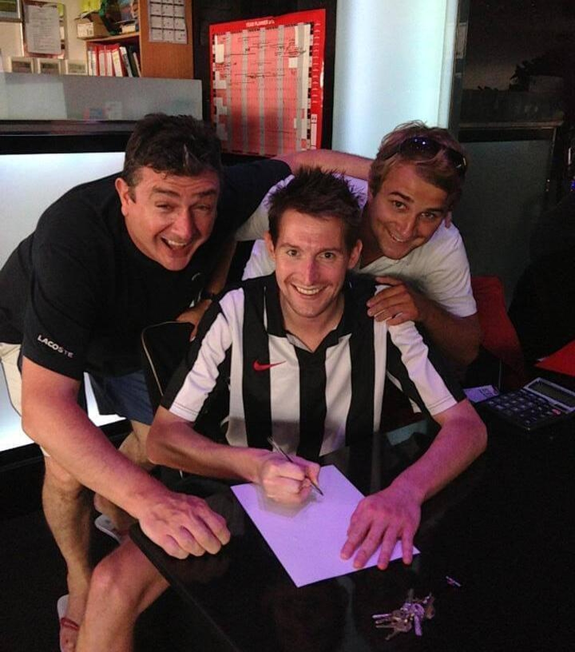 Bruno's Magpies make their first signing, with Mick and Louis on hand