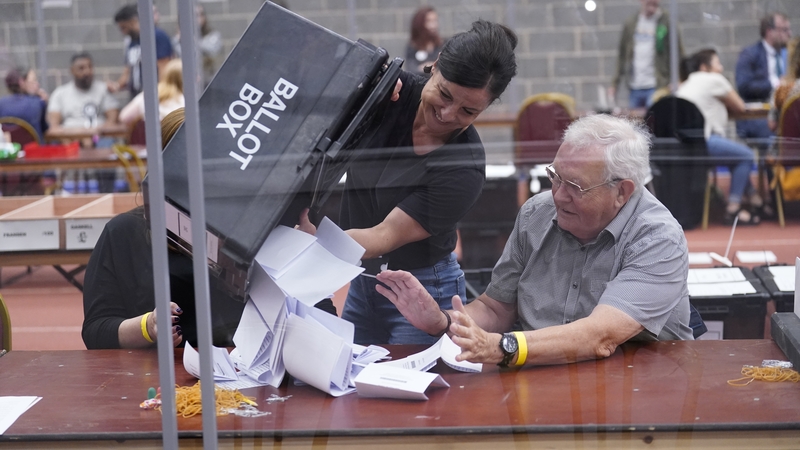 Votes are emptied from ballot boxes at a count centre in Wakefield, west Yorkshire