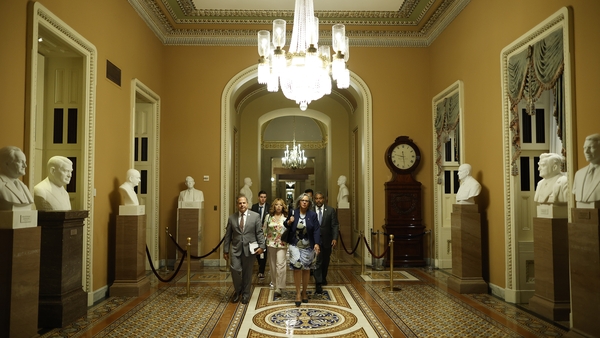 Democrats walk to the Senate Chamber to watch the vote on the Bipartisan Safer Communities Act