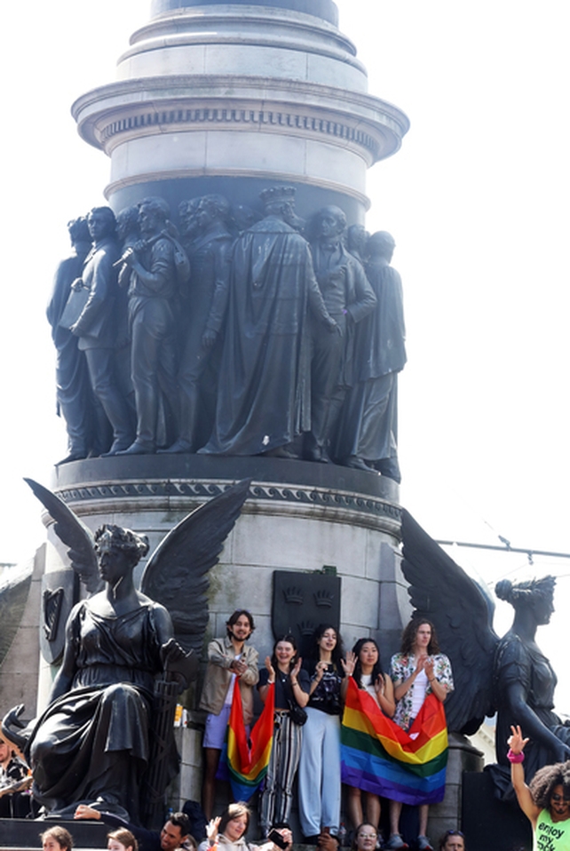 Supporters are pictured on the O'Connell Monument as the parade passes by (Pic: RollingNews.ie)