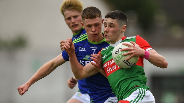Paul Gilmore of Mayo tackled by against Kerry's Fionn Murphy