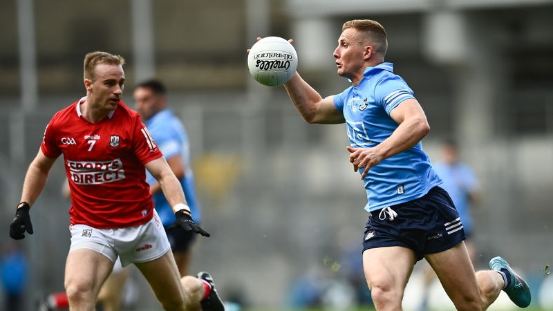 Dublin's Ciarán Kilkenny is tracked by Cork's Mattie Taylor