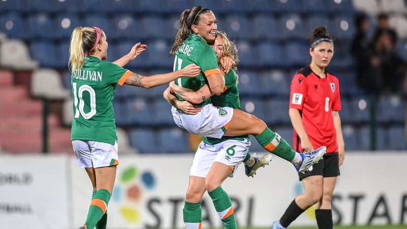Katie McCabe celebrates with team-mates Megan Connolly, right, and Denise O'Sullivan, after her third goal against Georgia