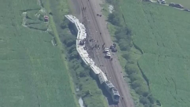 The derailed train lying on its side near Mendon, Missouri