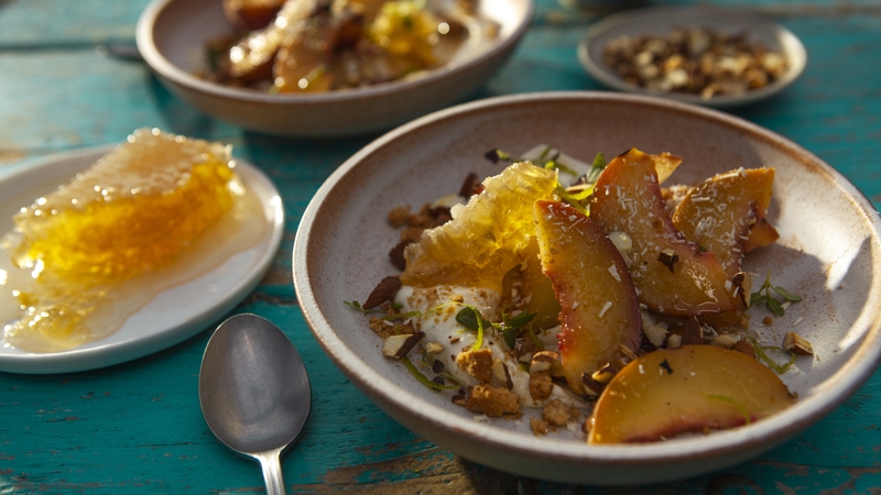 Fresh and juicy peaches grilled over flames pair perfectly with honey thyme mascarpone.